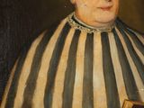 an old painting of a man in a striped robe holding a book