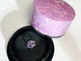 a purple box with a ring inside of it