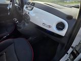 the interior of a car with the door open and the driver ' s seat up