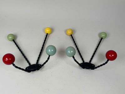 pair of multicolored beaded coat hooks on a white background