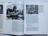 an open book with a black and white photo of a woman on a plane