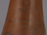 a close up of a copper bell on a table
