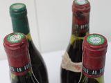 three bottles of wine sitting next to each other on a table