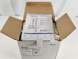 an open box of medical supplies sitting on top of a white surface