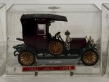 a small model of a car in a clear box