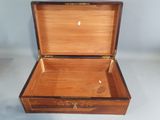 a small wooden box with a lid on a table
