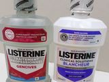 a bottle of listerine and a bottle of mouthwash on a table