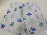 a close up of a white shorts with blue turtles on it