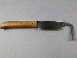 a knife with a wooden handle on a table
