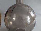 two vases that are sitting on a white surface