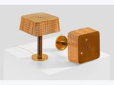 pair of rattan lamps and a wooden table lamp on a white surface