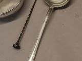 two spoons and a bowl on a table