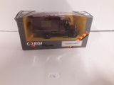 a box with a toy truck in it on a table