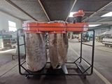 a cart that has two bags of fish on top of it