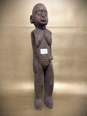 a close up of a statue of a person with a tag on it ' s chest