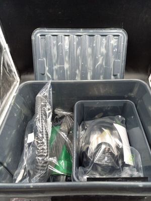 two bins of trash that are sitting in the back of a truck