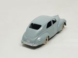 a toy car that is sitting on a white surface