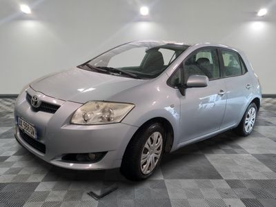 a picture of a silver toyota yaris parked in a garage