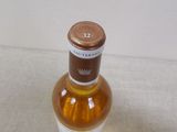 a small bottle of alcohol sitting on a table