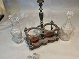 a candle holder that is sitting on a table next to other items