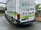 a white van that is parked in a parking lot