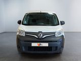 the white van is parked in a large room with a black floor