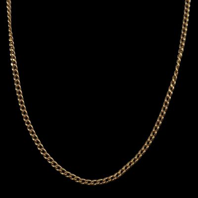 a gold chain on a black background