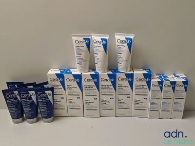 plusieurs tubes de produits d'hygiène bucco-dentaire posés sur une table à côté d'une boîte de dentifrice