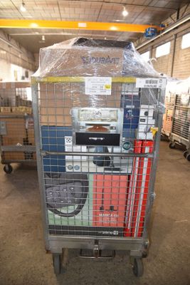 a large metal cart with a lot of boxes on it