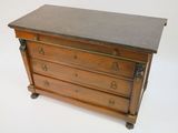 a small wooden chest of drawers with a marble top