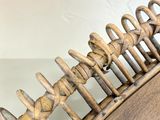 a wooden comb that is sitting on top of a table