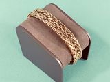a brown box with a gold chain on it