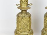 pair of antique brass candlesticks with ornate designs