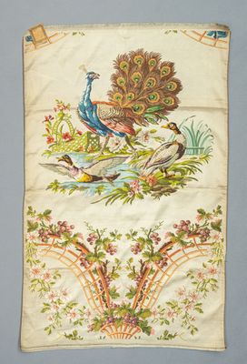 a close up of a piece of cloth with a peacock on it