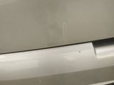 a close up of a car door handle with a sticker on it