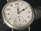three different types of watches sitting on a black surface