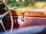 a close up of a steering wheel and dashboard of a vintage car