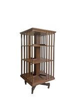 Bibliothèque tournante en bois naturel de section carrée à trois nivea