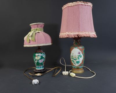 two lamps with pink shades and a pink shade on a black background
