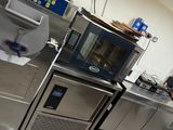 an image of a commercial kitchen with stainless steel appliances