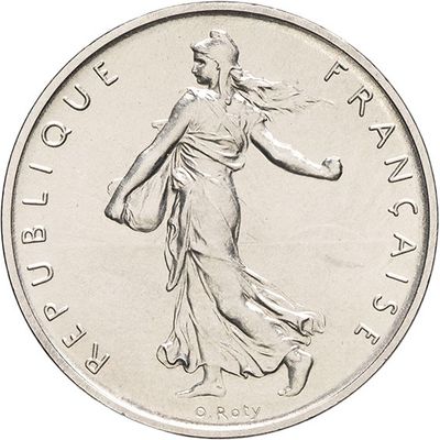the coin is silver and has a woman walking on it