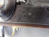 a close up of a gun that is on display