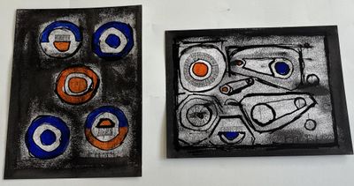 two paintings on the wall one is black and the other is blue and orange