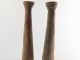 two vases that are sitting on a white surface