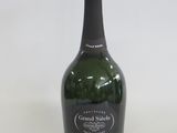 a bottle of wine that is sitting on a table