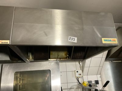 a kitchen with a stove and a microwave in it