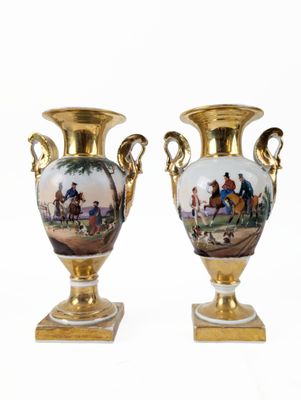 pair of antique vases with painted scenes on them sitting on a stand