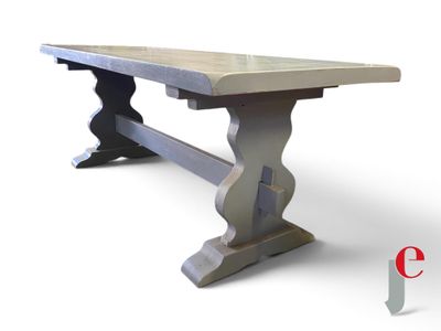 the table is made of wood and has a stone top
