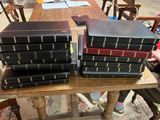 a lot of books sitting on a table in a room