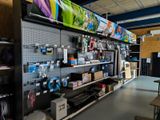 a room with a lot of different items on the shelves